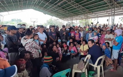 <p><strong>DIALOGUE.</strong> South Cotabato Gov. Reynaldo Tamayo Jr. (right, sitting down) talks to the residents of Barangay Ned, Lake Sebu who were displaced since last month by a “rido” or clan war in a nearby village in Palimbang, Sultan Kudarat. The governor mediated the nearly four-month conflict between warring families in his visit in Barangay Ned last Friday (July 5, 2019).<em> (Photo from the Facebook page of the Provincial Government of South Cotabato)</em></p>