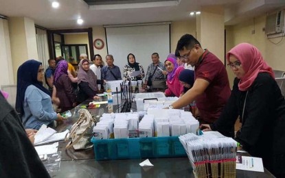 <p><strong>HAJJ BOUND.</strong> The National Commission on Muslim Filipinos this week started distributing the travel documents of the 7,163 Muslim Filipinos participating in this year's Hajj or pilgrimage to Mecca.<em> (Photo courtesy of NCMF)</em></p>