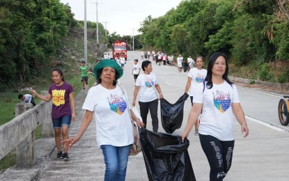 <p><strong>FUN WALK</strong>. Some residents in Burgos, Ilocos Norte join a 5-kilometer eco fun walk to advocate pollution-free environment. Running for nine years now, the eco fun walk every month of June continues to attract more volunteers and participants all over the world who share the same passion of caring for Mother Earth. <em>(Photo courtesy of Poblacion local government unit)</em></p>