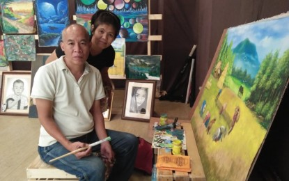 <p><strong>ARTS TO PAY FOR DIALYSIS.</strong> Artist Larry Casinao sells his paintings to defray the cost of the dialysis of his common-law-wife, Angelita Salazar. Megaworld’s Festive Walk plays a big brother to him by offering a free space where he can display his craft upon learning that he was asked to leave the streets where he used to display his panting. <em>(PNA photo by Perla G. Lena)</em></p>