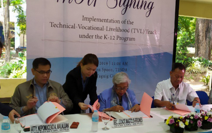 <p><strong>IMPROVING TECH-VOC EDUCATION. </strong>Department of Education (DepEd) Undersecretary and Spokesperson Nepomuceno Malaluan (left), DepEd Secretary Leonor Briones (center) and Technical Education and Skills Development Authority Director General Isidro Lapeña (right) sign a memorandum of understanding on the implementation of the technical-vocational-livelihood (TVL) track under the K to 12 Program at TESDA Complex, Taguig City on Tuesday (July 9, 2019). Through the MOU, DepEd and TESDA would establish a Joint Working Group to harmonize technical-vocational education and skills training in the Philippine basic education system. <em>(PNA photo by Ma. Teresa Montemayor)</em></p>