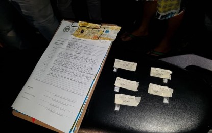 <p><strong>BUSTED.</strong> Anti-drug operatives seize five small sachets of suspected shabu from two target-listed pushers in a buy-bust operation in General Santos City on Tuesday (July 9). <strong><em>(Photo courtesy of PDEA-12)</em></strong></p>