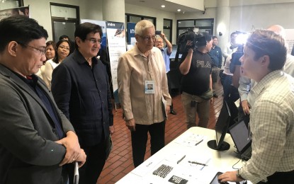<p><strong>AES TECH FAIR. </strong>DICT Secretary Gregorio “Gringo” Honasan II (2nd from left) and DICT Undersecretary Eliseo Rio, Jr. (3rd from left), listen as a representative from Voatz presents the company’s AES technologies. </p>