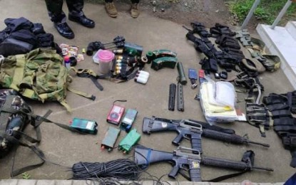 <p style="text-align: left;"><strong>CAMSUR CLASH.</strong> Photo shows the recovered high-powered firearms, ammunition and explosive devices following an encounter between government soldiers and communist rebels in a remote village in Tinambac, Camarines Sur on Sunday (July 14, 2019). A pursuit operation is still ongoing against the fleeing insurgents. <em>(Photo courtesy of Philippine Army's 9th Infantry Division)</em></p>