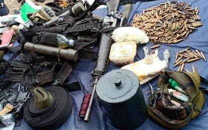 <p><strong>RECOVERED WEAPONS.</strong> Photo shows the high-powered firearms, explosives, anti-personnel mine, ammunition and alleged subversive documents recovered by government soldiers after an encounter with alleged rebels in Ayungon, Negros Oriental on Saturday (July 13, 2019). A suspected rebel was killed in the clash and buried in the town's public cemetery on Sunday (July 14, 2019). <em>(Photo courtesy of the Philippine Army)</em></p>