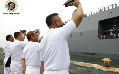 <p><strong>BON VOYAGE:</strong> Officials of the Philippine Navy wave their hats as BRP Davao Del Sur left for Vladivostok, Russia on Monday (July 15, 2019).  The BRP Davao Del Sur and the 300-man contingent on board will participate in the Naval Parade during the Russian Navy  Day from July 24 to 29.<em> (Photo courtesy of PN)</em></p>