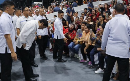 <p><strong>STILL POPULAR</strong>. President Rodrigo Roa Duterte takes a bow before the Overseas Filipino Workers (OFWs) during the "Araw ng Pasasalamat" for the OFWs at Camp General Emilio Aguinaldo in Quezon City on July 12, 2019. Malacañang on Thursday (July 18) expressed confidence that Duterte will sustain his high approval and trust ratings until the end of his term in 2022. <em>(Rey Baniquet/Presidential Photo)</em></p>