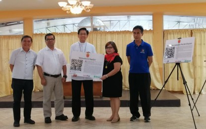 <p><strong>DIGITAL TOURISM. (L-R)</strong> Msgr. Julius Heruela, Msgr. Glenn Corsiga, Bishop Julito Cortes, lawyer Ma. Jane Paredes, and Fr. Roman Sagun, lead the launching of Smart Communications' Digital Tourism Program and the turnover of Quick Response Code Markers in Dumaguete City on Monday (July 15, 2019). The project aims to promote awareness on the significance and magnitude of the 500th anniversary of the birth of Christianity in the Philippines.<em> (Photo by Judy Flores Partlow)</em></p>