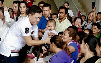 <p><strong>HELP FOR FIRE VICTIMS.</strong> Senator Christopher Lawrence "Bong" Go interacts with fire victims in Lapu-Lapu City as he extends them assistance on Tuesday (July 16, 2019). He vowed to support President Rodrigo Duterte in case the Chief Executive decides that the Philippines should sever its diplomatic relations with Iceland, for sponsoring a resolution at the United Nations Human Rights Council (UNHRC) seeking a probe into the alleged human rights concerns in the country. <em>(Photo by John Rey Saavedra)</em></p>