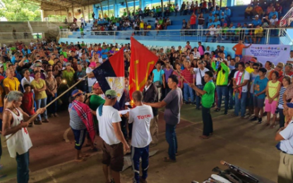 <p><strong>NPA FLAG TORCHING.</strong> Former New People’s Army insurgents torch rebel flags as they renounce communism during a mass surrender ceremony in President Roxas, North Cotabato on Monday (July 15, 2019). <em>(Photo courtesy of 901st IB)</em></p>