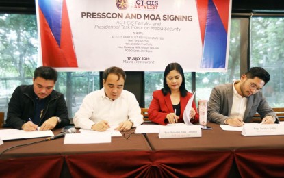 <p class="p1"><strong>MEDIA PROTECTION. </strong> Undersecretary Joel Sy Egco (second from left), Executive Director of the Presidential Task Force on Media Security (PTFoMS), and ACT-CIS Party-list Representative Niña O. Taduran (second from right) sign a memorandum of agreement on media security at Max Restaurant in Quezon Memorial Circle, Quezon City on Wednesday (July 17, 2019).  The ACT-CIS Party-list is pushing for the passage of the Media Workers Welfare Act which will provide equal protection and standardized remuneration. Also in photo are PTFOMS chief of staff Abraham A. Gamata (left) and Garreth Tunglo (right) representing ACT-CIS Rep. Jocelyn Tulfo.<em> (PNA photo by Ben Briones)</em></p>