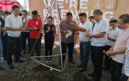 <p><strong>SAN MIGUEL BREWERY.</strong> San Miguel Brewery, Inc. President Roberto Huang (third from right) lowers the time capsule after the site blessing of the San Miguel-San Fabian Brewery at Barangay Bolasi, San Fabian, Pangasinan on Wednesday (July 18, 2019). Looking on are Mayor Constante Agbayani (fourth from right) and other officials from San Fabian and SMB. <em>(Photo by Liwayway Yparraguirre)</em></p>