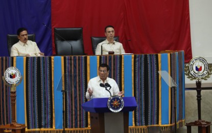 <p><strong>SONA 2019</strong>. President Rodrigo Duterte delivers his 4th State of the Nation Address at Batasang Pambansa on Monday (July 22, 2019). Behind him are Senate President Vicente Sotto III (left), and House Speaker Alan Peter Cayetano. (<em>PNA photo by Avito C. Dalan</em>)</p>
<p> </p>