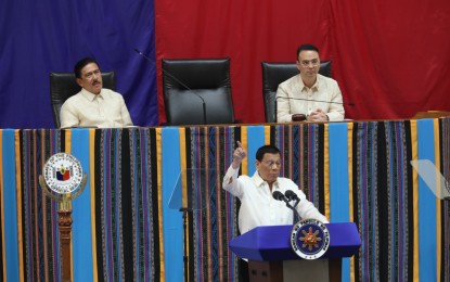 <p><strong>BALANCING ACT</strong>. President Rodrigo Duterte tackles the West Philippine Sea issue in his 4th State of the Nation Address (SONA) on Monday (July 22, 2019). He said the avoidance of conflict and protection of the country's territorial waters compel the government to perform a delicate balancing act on the issue. <em>(PNA photo by Avito C. Dalan)</em></p>