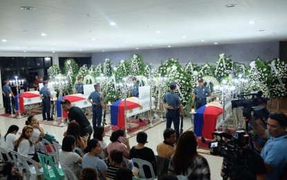 <p><strong>WAKE OF SLAIN COPS.</strong> The remains of Cpl. Relebert Beronio, and Patrolmen Raffy Callao, Ruel Cabellon, and Marquino de Leon of the Regional Mobile Force Battalion 7 (RMFB7), lie in state at the multi-purpose hall of the Negros Oriental Provincial Police Office (NOPPO) at Camp Francisco Fernandez in Agan-an, Sibulan town, in a file photo taken on Saturday, (July 20, 2019). The four cops were tortured and killed allegedly by 15 or more members of the New People’s Army. <em>(Presidential Photo)</em></p>
