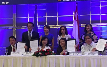 <p><strong>DOH, PARTNERS INK PPP DEAL</strong>. Health Undersecretary Lilibeth David, International Finance Corporation country manager for the Philippines Yuan Xu, University of the Philippines president Danilo Concepcion, and Singapore Cooperation Enterprise chief executive officer Wy Mun sign a memorandum of understanding, on Tuesday (July 23, 2019) to strengthen the collaboration between the particiapting organizations of the first private-public partnership for the Universal Health Care launched at the Century Park Hotel. <em>(Photo by: Ma. Teresa Montemayor)</em></p>