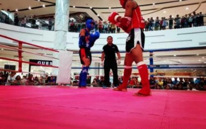 <p><br /><br /><strong>HOMEGROWN ATHLETE.</strong> A Muay Thai boxer from Kidapawan City (blue jersey) prepares to attack an opponent from Tagum City during the July 9-13, 2019 Muay Thai Mindanao leg championship held in Butuan City. <em>(Photo courtesy of Kidapawan CIO)</em></p>