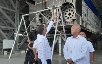 <p><strong>GLOBAL SHIPBUILDER.</strong> Austal Philippines President Wayne Murray briefs Defense Secretary Delfin Lorenzana on a catamaran ship currently under construction at the company's facility in Arpili, Balamban town in Cebu on Wednesday afternoon (July 23, 2019). Lorenzana said the national government is tapping Austal Philippines for PHP30-billion contract to build six Offshore Patrol Vessels (OPV) for the Philippine Navy.<em> (PNA photo by John Rey Saavedra)</em></p>