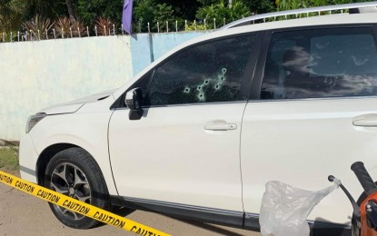 <p><strong>LAWYER SHOT DEAD. </strong>The white Subaru sports utility vehicle that lawyer Anthony Trinidad was driving bumps into a fence after he was shot dead at close range by unidentified motorcycle-riding in tandem suspects along the national highway in Guihulngan, Negros Oriental on Tuesday afternoon. The motive for the killing has yet to be determined.<em>(Photo contributed by Katriele Gay U. Serion)</em></p>