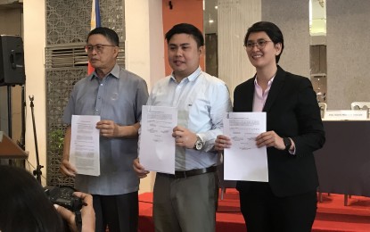 <p><strong>PREVENTING ROAD ACCIDENTS THROUGH JMC 2018-001. </strong>(From left) LTO Assistant Secretary Edgar Galvante, DOTr Undersecretary For Road Transport and Infrastructure Mark Richmund de Leon and lawyer Sophia Monica San Luis, executive director of ImagineLaw present JMC 2018-001 to the media during a ceremonial signing at the Hive Hotel in Quezon City on July 25, 2019. (Photo by Raymond Carl Dela Cruz)</p>