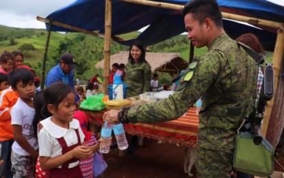 <p><strong>REACHING OUT.</strong> Soldiers of the Army’s 6th Infantry Battalion, together with volunteer-partners, bring food and school supplies to indigenous peoples’ children in Maguindanao’s upland community of Sitio Senamfledon, Barangay Looy, South Upi, Maguindanao on Wednesday, July 24, 2019. <em>(Photo courtesy of 6IB)</em></p>