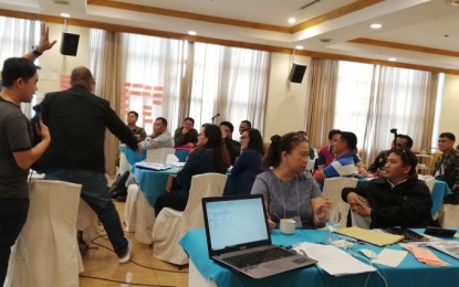 <p><strong>CREATING A CONTINGENCY PLAN.</strong> Members of the Regional Disaster Risk Reduction and Management Council 6 (Western Visayas) meet for the creation of a contingency plan for typhoons, at a hotel in Iloilo City on Wednesday (July 24, 2019). Melissa Banias, capability building section officer of the Office of Civil Defense 6, said the contingency plan would boost the region’s preparedness before the onslaught of more typhoons during the "ber" months.<em> (PNA Photo by Gail Momblan)</em></p>