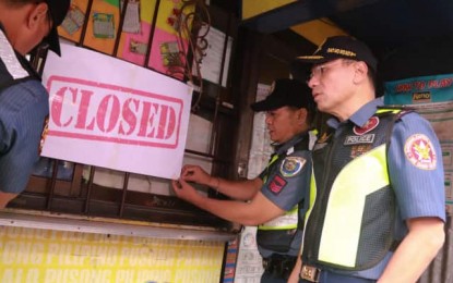 <p><strong>SHUT DOWN.</strong> Maj. Gen. Guillermo Eleazar (right), National Capital Region Police Office (NCRPO) director, leads operations to close down lotto and other betting outlets for Philippine Charity Sweepstakes Office-licensed games in the cities of Pasig and Quezon City on Saturday (July 27, 2019). The operations were conducted in compliance with the directive of President Rodrigo Duterte revoking all gaming franchises and concessions issued by the PCSO due to reports of massive corruption and irregularities. <em>(Photo courtesy of NCRPO)</em></p>