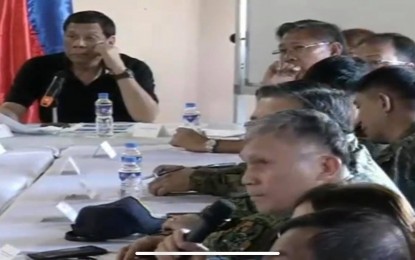 <p><strong>BATANES VISIT.</strong> President Rodrigo Duterte meets with national and local officials in Basco, Batanes on Sunday (July 28, 2019) after making an aerial surveillance to assess the damages caused by a series of earthquakes in Itbayat town of the same province a day earlier. The Chief Executive ordered the construction of a P40-million clinic in that will replace the hospital that was damaged by the tremors in the said island town. <em>(Screengrab from RTVM video)</em></p>
