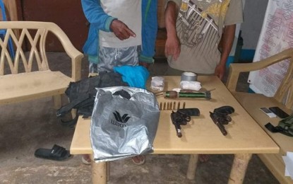 <p><strong>SEIZED.</strong> Police arrested two suspected members of the New People's Army in Sitio Yamot, Barangay Mabato in Ayungon late Monday afternoon (July 29, 2019), following an encounter between government troops and alleged NPA members in the adjacent town of Bindoy. Recovered from the two suspects were two .38-caliber revolvers without serial numbers, a rifle grenade, two sets of bombs, a piece bandolier, an eco-bag, and a plastic bag. (Photo courtesy of Ayungon Police Station)</p>
