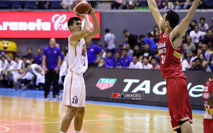 <p><strong>WEEK’S BEST</strong>. TnT’s forward Troy Rosario shoots from the arc during the PBA Commissioner’s Cup semifinals series opener which the Katropa won, 95-92, over defending champion Barangay Ginebra on July 26. Rosario played a crucial role in TNT’s three straight wins that earned him the PBA Press Corps-Cignal Player of the Week plum. <em>(Photo courtesy of PBA)</em></p>