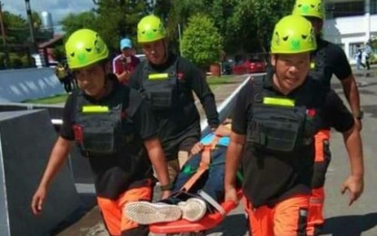 <p><strong>DISASTER PREPAREDNESS.</strong> Rescue workers carry to safety a supposed disaster victim during a simultaneous inter-office earthquake drill conducted inside the Shariff Kabunsuan Complex, the provisional seat of the Bangsamoro Autonomous Region in Muslim Mindanao in Cotabato City on Tuesday (July 30, 2019). More than 300 employees inside the compound participated in the drill exercise. <em>(Photo courtesy of Dennis Arcon-DXMY Cotabato)</em></p>
