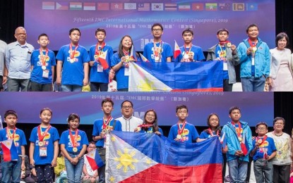 <p><strong>MATH WIZARDS</strong>.  Filipino gold medalists display the Philippine flag at the awarding ceremony of the 15th International Mathematics Contest (IMC) in Singapore. The Philippines also captured 54 silver and 108 bronze medals as well as 80 merit awards. <em>(Photo by MTG)</em></p>