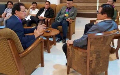 <p><strong>BUSINESS PROSPECTS.</strong> Bangsamoro Autonomous Region in Muslim Mindanao Chief Minister Ahod Ebrahim (right, sitting with eyeglasses) talks to the Malaysian business delegation during a visit at the BARMM compound in Cotabato City on Aug. 5, 2019. The Malaysian group expressed interest in putting up various business ventures in BARMM that includes Halal (Islamic) food processing, toy making, and rubber materials production. <em>(Photo courtesy of BPI-BARMM)</em></p>