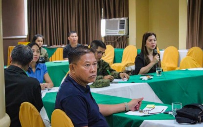 <p><strong>STRATEGIC COMMUNICATIONS.</strong> Fayette Riñen (right, holding the microphone), regional head of the Philippine Information Agency (PIA-7) and head of the Regional Task Force on Ending Local Communists Armed Conflict 7 (RTF-ELCAC) Strategic Communication Cluster, discusses the messaging and slogans that will be cascaded down to the provincial task forces in the region, in a meeting at the Cebu Business Hotel in Cebu City on Tuesday (Aug. 13, 2019). Riñen said the strategic cluster of the regional task force to end insurgency will now go full blast with its information and education campaign aimed to end armed conflict in New People’s Army-infested areas in Central Visayas. <em>(Photo contributed by PIA-7)</em></p>