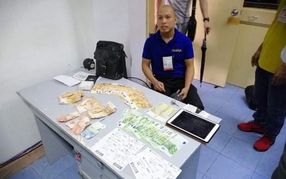 <p><strong>HONEST WORKER.</strong> NAIA 1 janitor Sixto Brillante Jr. hands over a bag left by a passenger to airport authorities on Saturday (Aug. 10, 2019). The bag contained EUR7,300, an iPad and a wallet. <em>(Photo courtesy of MIAA)</em></p>