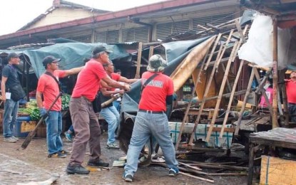 <p><strong>DEMOLITION.</strong> Personnel of Bacolod City Legal Enforcement Unit dismantle the illegal structures of vendors outside the Burgos North Market last week. Almost 170 vendors occupying Burgos and Daniel Ramos Streets have been removed and transferred inside the main market. <em>(Photo courtesy of Bacolod City PIO)</em></p>