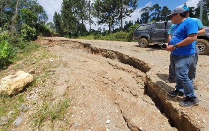 <p><strong>TENSION CRACK.</strong> Mines and Geosciences Bureau (MGB)-12 personnel assess a portion of a road network in Barangay Ned, Lake Sebu town in South Cotabato that was affected by tension cracks and landslides. Ariel Acosta, MGB-12 supervising geologist, said Tuesday (Aug. 13) they recommended the immediate relocation of affected residents and re-routing of landslide-hit roads in five sitios of Barangay Ned. <em>(Photo courtesy of MGB-12)</em></p>