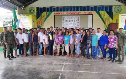 <p><strong>FORMER NPA SUPPORTERS.</strong> Residents of Barangay Antipolo, Gabaldon, Nueva Ecija renounce their support to the New People's Army and take their oath of allegiance to the government at the Antipolo Elementary School on Aug. 6, 2019. Maj. Gen. Lenard T. Agustin, commander of the Philippine Army’s 7th Infantry Division, lauded their decision. <em>(File photo courtesy of 91IB)</em></p>