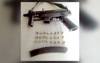 <p>A KG9 sub-machine gun, magazine and ammunition recovered by government troops during security patrol operations in Guihulngan City, Negros Oriental over the weekend. <em>(Photo courtesy of the Philippine Army)</em></p>