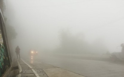 <p><strong>ZERO VISIBILITY.</strong> A thick blanket of fog covers Baguio City due to the continuous downpour the past weeks. On Naguilian Road leading to Bauang, La Union and the Ilocos region, motorists experience zero visibility. <em>(PNA photo by Liza T. Agoot)</em></p>