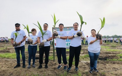 <p><strong>TREES FOR THE FUTURE.</strong> Lubao Mayor Esmeralda G. Pineda (extreme right) leads the planting of more than 400 fruit-bearing trees at the Lubao Bamboo Hub and Ecopark in Barangay Sta. Catalina, Lubao, Pampanga Thursday (Aug. 15, 2019). With her are (from left) Vice Mayor Jay Montemayor, Provincial Disaster Risk Reduction and Management Officer Angelina Blanco, Board Member Tonton Torres, Rep. Juan Miguel “Mikey” Arroyo and Pampanga Governor Dennis Pineda. <em>(PNA photo by Marna Dagumboy-del Rosario)</em></p>