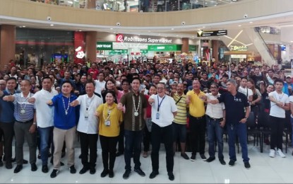 <p><strong>TSUPER ISKOLAR.</strong> Top officials of the Technical Education and Skills Development Authority (TESDA) and the Department of Transportation (DOTr) pose with members of transport groups and associations in Iloilo, during the launch of the 'Tsuper Iskolar' program at Robinsons Place Pavia in Pavia, Iloilo on Friday (August 16, 2019). Secretary Isidro S. Lapeña, director-general of TESDA, said the training seeks to improve the skills of drivers to give them more income opportunities. <em>(PNA photo by Perla G. Lena)</em></p>