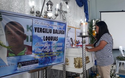 <p><strong>GRIEVING WIDOW</strong>. Juana Loquias sobs at the wake of her husband, Virgelio, who was killed by the New People's Army in San Antonio, Hilongos, Leyte. <em>(PNA photo by Roel Amazona)</em></p>