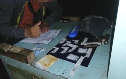 <p><strong>DRUG HAUL.</strong> A police operative writes down an inventory of the suspected shabu, worth PHP101,000, a revolver and ammunition that were confiscated from a suspected drug pusher during a buy-bust operation in Dumaguete City on Wednesday (August 21, 2019). The suspect was on the city’s drug watchlist. <em>(Photo courtesy of the Negros Oriental Provincial Police Office)</em></p>