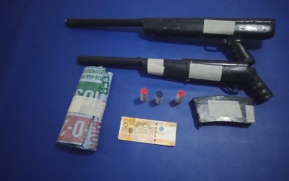 <p><strong>SEIZED.</strong> Photo shows improvised shotguns, a magazine, and some rounds of ammunition seized from an alleged firearms dealer during an entrapment operation in Canlaon City, Negros Oriental on Wednesday, Aug. 21, 2019. The suspect was arrested after he allegedly sold some firearms to an undercover cop. <em>(Photo courtesy of Negros Oriental Provincial Police Office)</em></p>