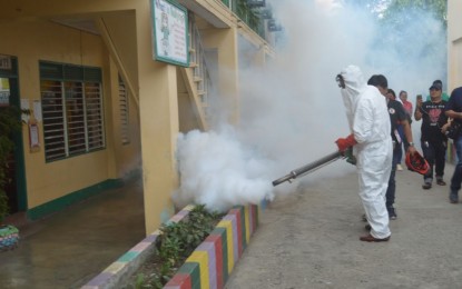 <p>Iligan City Mayor Celso Regencia leads the ceremonial fogging during the launching of Deng-Get Out 4S Habit inside South 1A Central School in Barangay Tubod, Iligan City, August 20. The local government has declared Iligan City under the state of calamity after the Department of Health announced an actual dengue outbreak following the continuous rising of case fatality rate of 1.15% that beyond the normal .4% according to the DOH-10. (Photo by Divina M. Suson)</p>