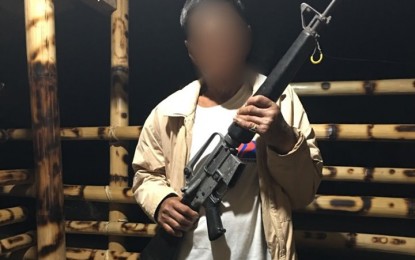 <p><strong>SURRENDERER.</strong> Alias "Tatay Tawara," a former member of the New People's Army's Guerilla Front 71, shows the M16 Armalite rifle he surrendered to the Army's 73IB in Malapatan, Sarangani province. He decided to surrender early this week after being convinced by his son, a rebel returnee-turned government militiaman. <em>(Photo courtesy of the 73IB)</em></p>