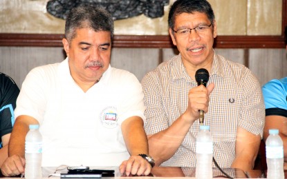 <p><strong>GRANDSLAM SEEKER.</strong> San Miguel Beer head coach Leo Austria (right) discusses his team's preparations for the upcoming PBA Governor's Cup, during the 36th TOPS “Usapang Sports” Forum at the National Press Club in Intramuros, Manila on Thursday (August 22, 2019). Austria said the team's upcoming participation in a Macau tournament next month will boost San Miguel Beer's bid for a grand slam finish this year. Also in photo is TOPS president Ed Andaya. <em>(PNA photo by Jess M. Escaros Jr.)</em></p>