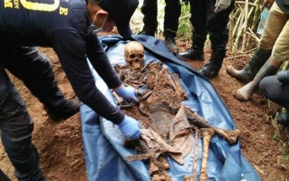 <p><strong>PROOF OF ATROCITY.</strong> Personnel of the Army's 403rd Infantry Brigade and police officers from the Scene of the Crime Operatives exhume the skeletal remains of three individuals that the New People's Army abducted and killed in 2017 in Kitaotao town, Bukidnon, on August 23. Authorities say the remains belong to a soldier, a retired police officer, and a tribal leader.<em> (Photo courtesy of Eastmincom)</em></p>