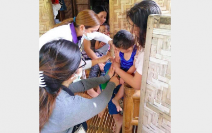 <p><strong>IMMUNIZATION.</strong> Mati City Health Office personnel conduct house-to-house immunization in Purok Gemelina, Barangay Don Salvador Lopez, Mati City on Friday (Aug. 23, 2019), following the death of two kids due to measles. <em>(Photo courtesy of Mati CIO)</em></p>